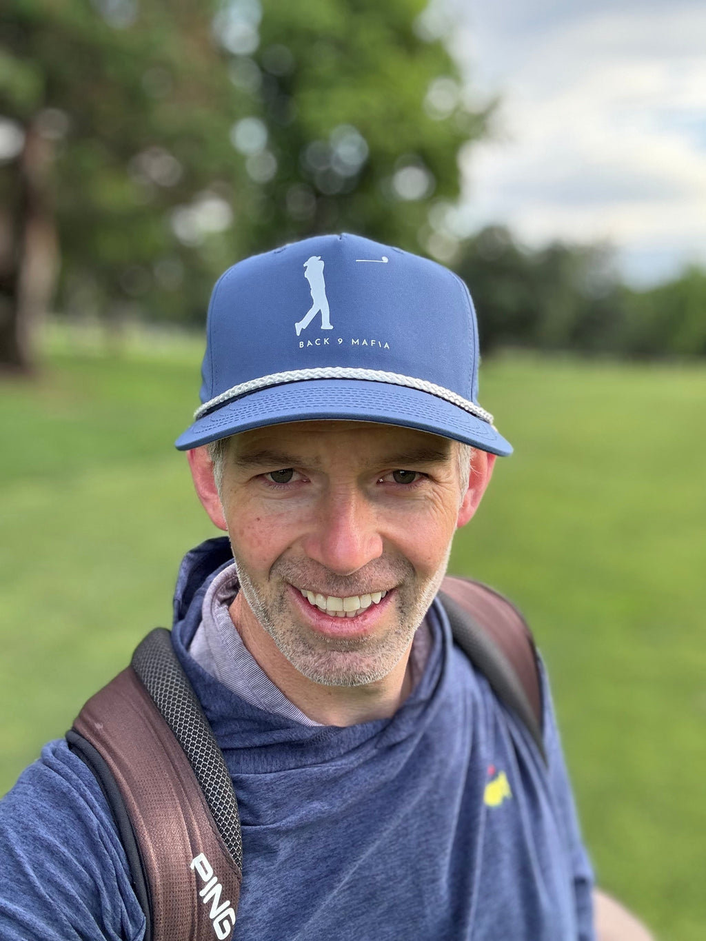 Mafia Rope Hat in light blue, worn on the course at sunrise