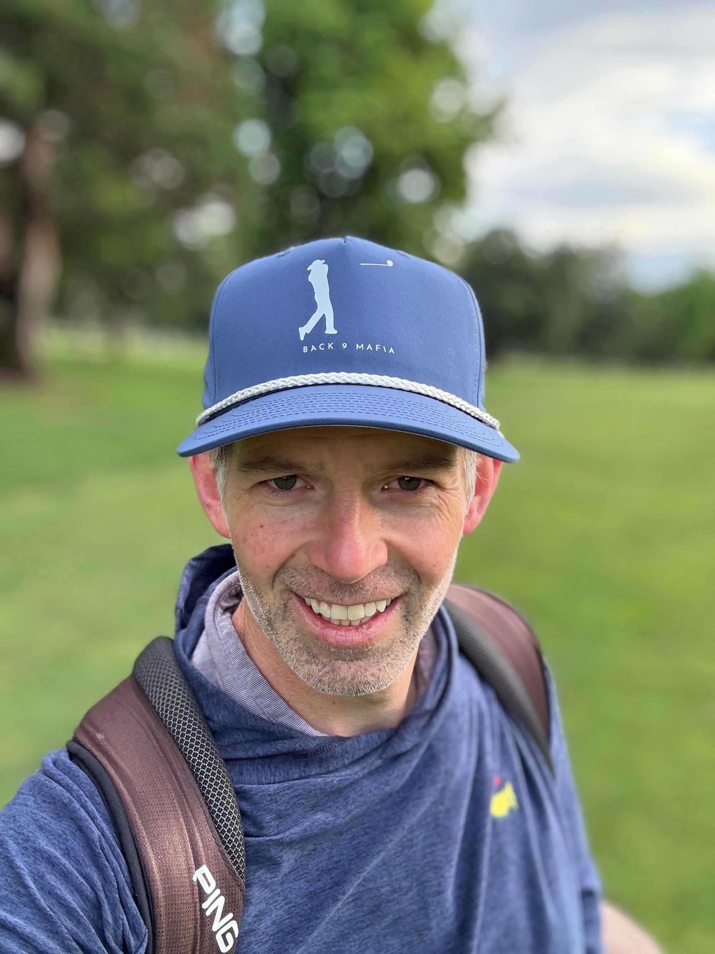 Mafia Rope Hat in light blue, worn on the course at sunrise